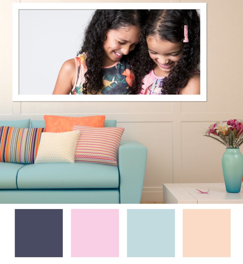 Family photo of two girls, big smiles, displayed at home, showcasing interior design and soft palette. Photographed by Enhance Photography Studios.