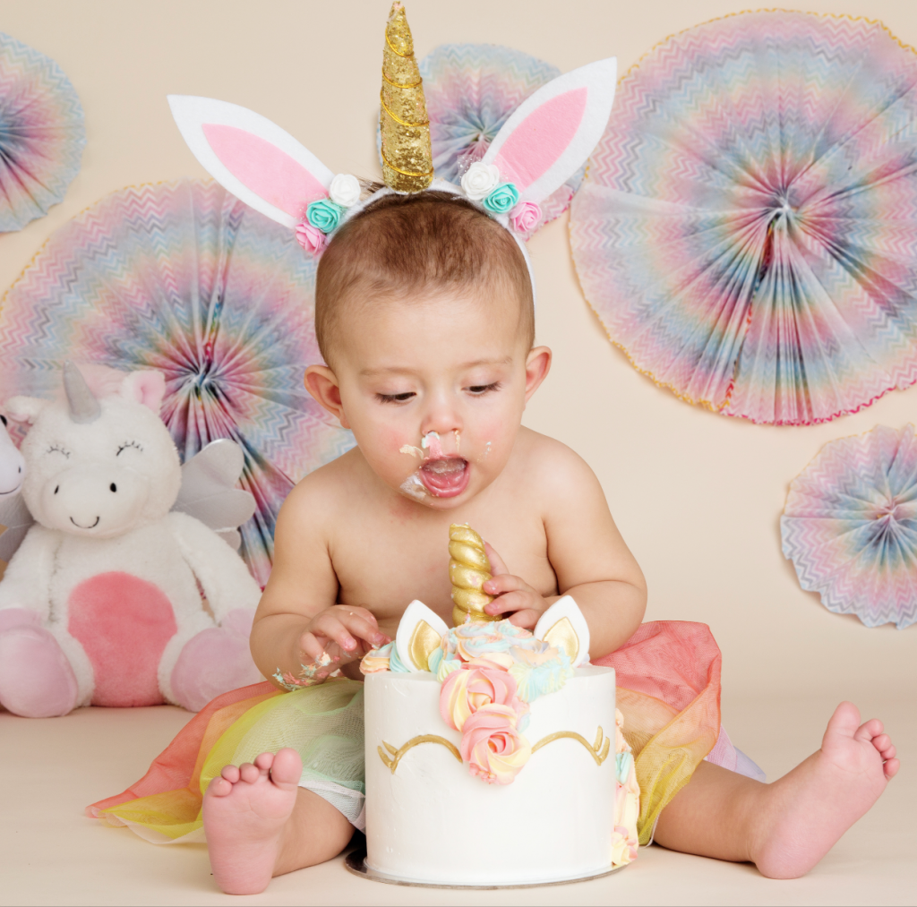 cute baby girl unicorn dress up first birthday rainbow glitter cake smash melbourne photography